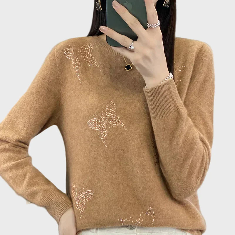 Cuello alto de punto con diseño de mariposa