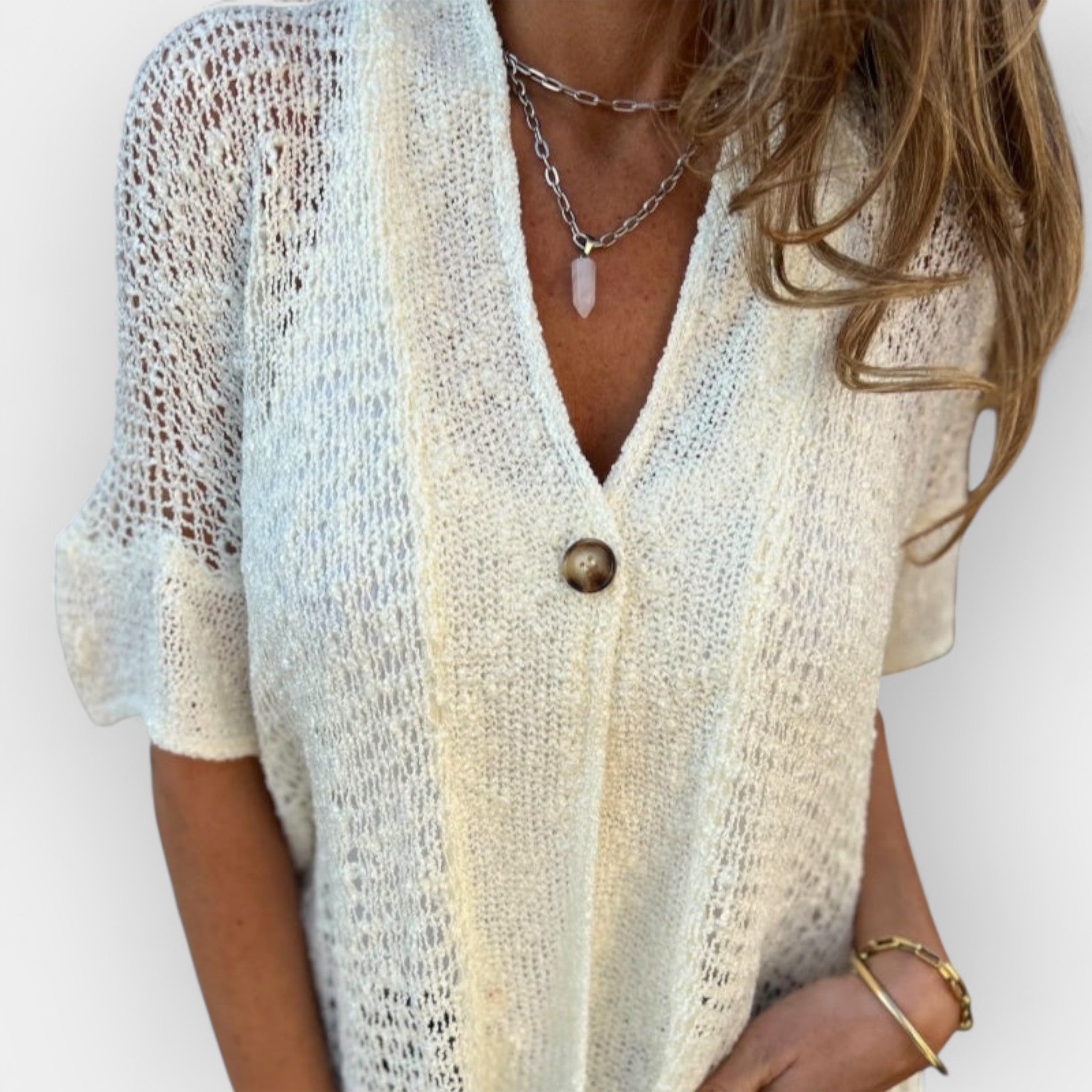 Top de punto con escote en V y botón